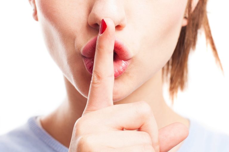 Girl with finger on mouth illustrates: "Some Ideas to Reduce Air Conditioning Noise"