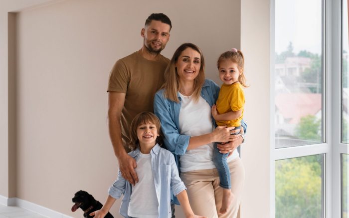 Family of four with dog illustrates blog "What Does an AC Condenser Coil Do?"