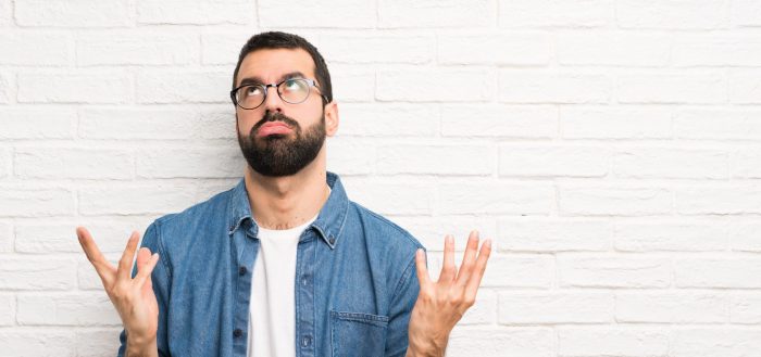 Frustrated man illustrates blog "Why Does My HVAC Fuse Keep Blowing?"