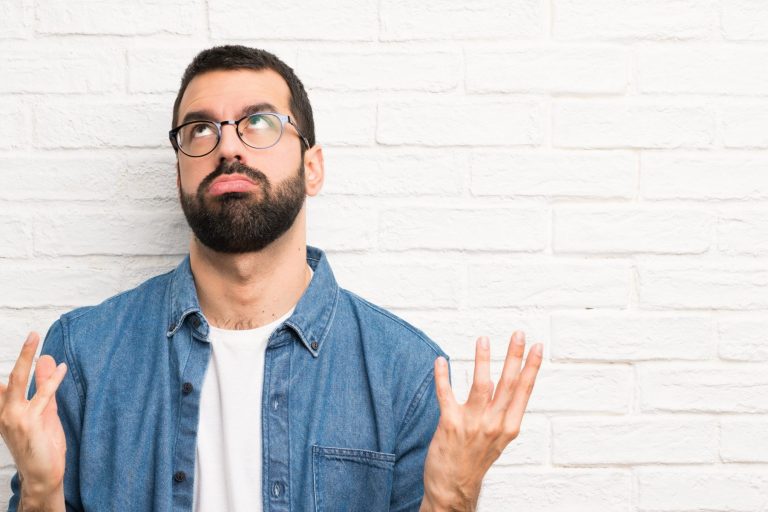 Frustrated man illustrates blog "Why Does My HVAC Fuse Keep Blowing?"