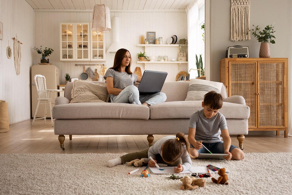 family-ac-fp Mother and two children in living room illustrates blog "What Causes Mold on AC Coils?"